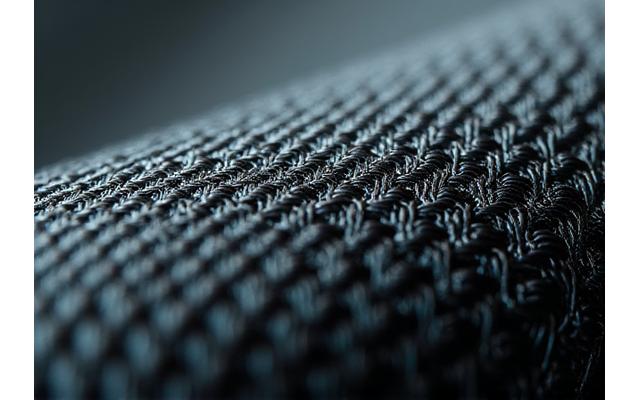 Nahaufnahme von hochmodularen Carbonfasern, die Präzision und Stärke symbolisieren.